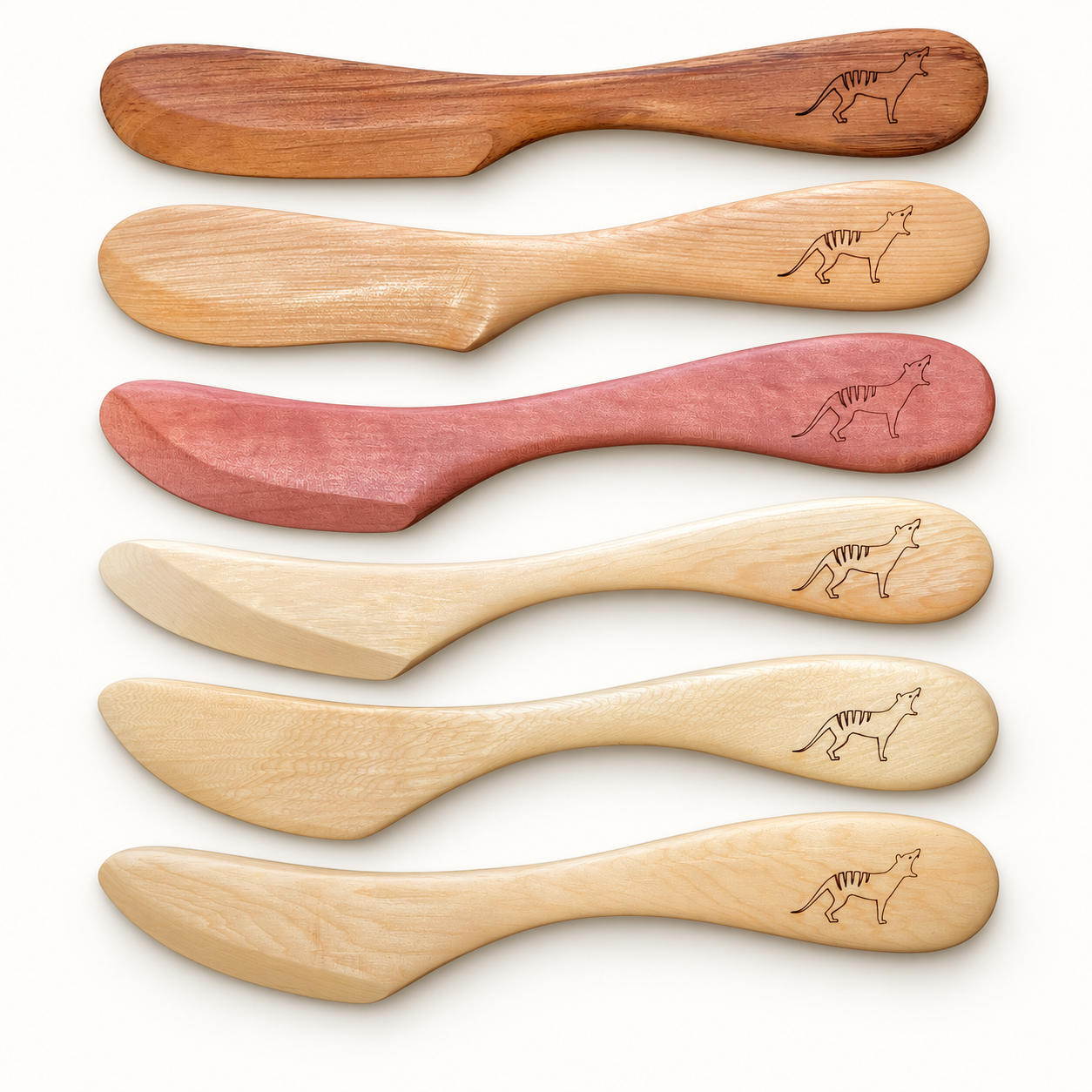 Hand-shaped Tasmanian timber spreaders engraved with a thylacine motif